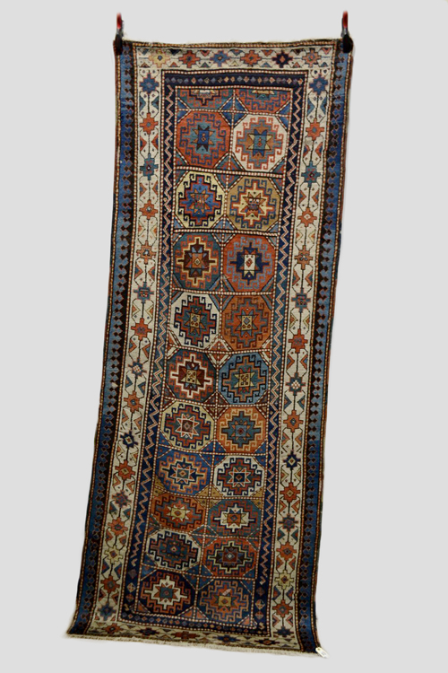 Moghan long rug of compartmented Memling gul design, south east Caucasus, late 19th/early 20th