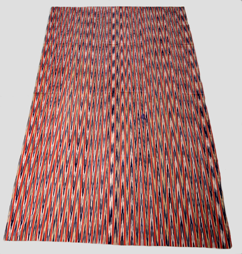 Attractive striped cotton cover, the very narrow stripes woven with an ikat design, probably