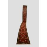 Very narrow Hamadan runner, north west Persia, circa 1930s, 25ft. 10in. x 2ft. 5in. 6.88m. x 0.