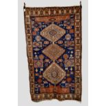 Shirvan triple medallion rug, south east Caucasus, first half 20th century, 8ft. 5in. x 5ft. 2.