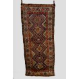 Kazak hooked medallion long rug, south west Caucasus, late 19th century, 9ft. 1in. x 3ft. 11in. 2.
