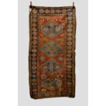 Kurdish long rug with inscription, north west Persia, early 20th century, 8ft. x 4ft. 2in. 2.44m.