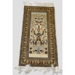 Tunisian silk prayer rug, second half 20th century, 3ft. 6in. x 1ft. 9in. 1.07m. x 0.54m. With
