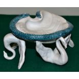 A limited edition Limoges bisque modern dish with a blue glazed snake to the rim, on three