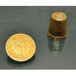 A 9ct Victorian gold thimble, also a George IV 1825 gold sovereign (worn).