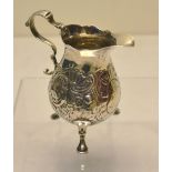 A George II silver baluster cream jug, with contemporary rococo chasing, the cartouche engraved on a