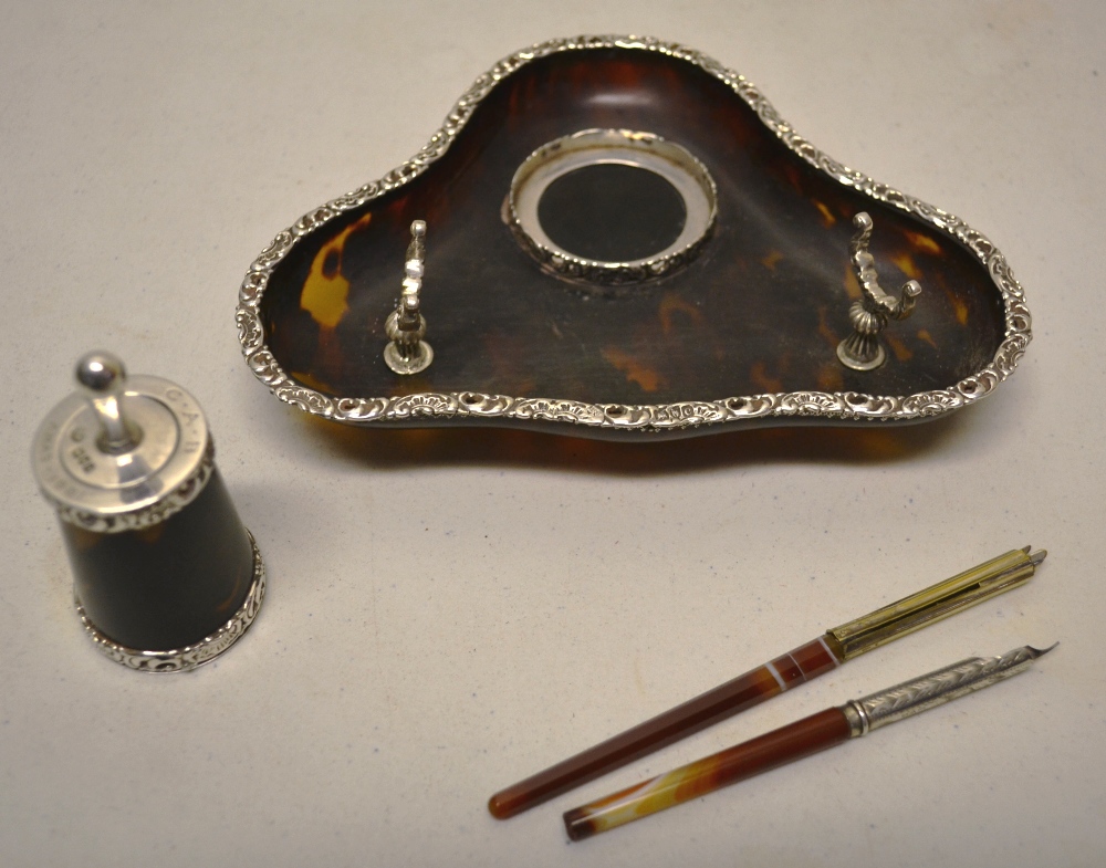 A late Victorian silver mounted tortoiseshell triform inkstand, with pen rests, a tortoiseshell