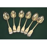Six early to mid-nineteenth century silver fiddle pattern table spoons, one engraved an initial,