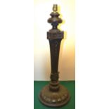 A large carved wood table lamp, in Neo Classical style with foliage bell flowers, and scalework,