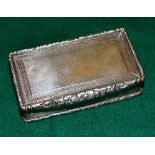 A William IV rectangular silver snuff box, engine turned border to the hinged lid, reeded sides