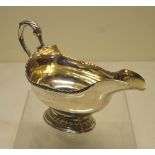 An early George III Scottish silver oval sauceboat, with gadroon borders, engraved a crest with