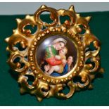 A Continental late nineteenth century porcelain circular plaque of Raphael's Holy family, in an