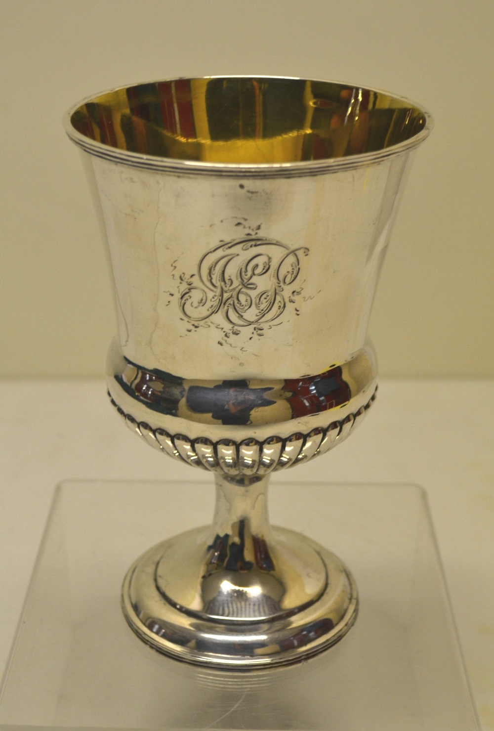 A Regency campana shape wine goblet, part ribbed and engraved contemporary initials, gilded