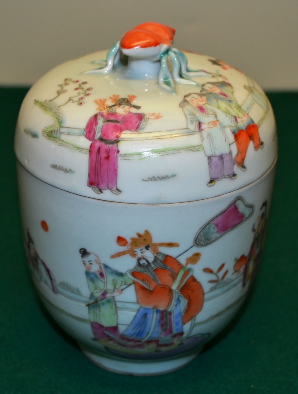 A Chinese famille rose porcelain jar and cover, decorated a mandarin and his family with