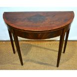 A Sheraton period mahogany veneered half round card table, the well figured top baize lined and