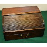 A Regency mahogany portable desk, with a tambour shutter encasing a compartment with two drawers,