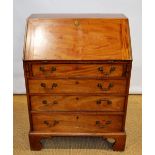 A small George III mahogany bureau, the fall flap reveals a fitted interior above four long