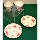 A pair of eighteenth century Chinese famille rose porcelain beakers and saucers, decorated foliage w