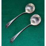 A pair of George III silver sauce ladles, feather edge Old English pattern, with raised initialled c