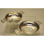 A pair of Edwardian silver quaiches, the circular bowls inscribed, having the pierced handles