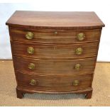 A small Sheraton mahogany veneered bow front chest, of four graduated drawers, with brass rosette