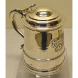 A George III silver quart tankard, the tapering sides with an engraved contemporary coat of arms