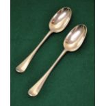 A pair of early George III Scottish silver Hanovarian pattern table spoons engraved initials.