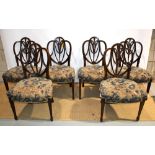 A set of six mahogany Adam Revival side chairs in Hepplewhite style, the shaped open backs carved