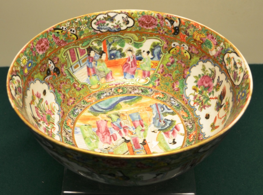 A nineteenth century Cantonese porcelain punch bowl, decorated in famille rose enamels court - Image 2 of 2