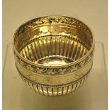 A Victorian silver bowls, part ribbed with a beaded looped band engraved initials and a repouse
