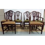 A set of six late eighteenth century mahogany dining chairs, with pierced balloon splat backs, the d
