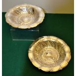 A pair of Arts and Crafts circular dessert dishes, lightly hammered with sprays of beading and