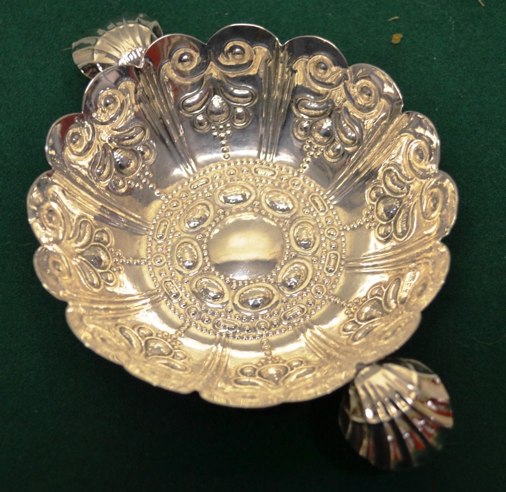 An Edwardian silver copy of a Charles 1st sweetmeat dish, repouse decorated with two scallop shell h