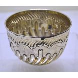 A late Victorian silver bowl, part swirl fluted engraved a spreadeagle crest. Maker Slater and