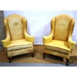 A high wing back three piece sitting room suite, upholstered gold coloured figured material, the