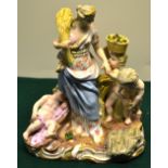 A nineteenth century Meissen porcelain group depicting Autumn, the maiden holding a wheatsheaf,