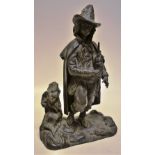 A nineteenth century bronze figure of a Tyrolean piper, standing on rocky ground by a tree stump.