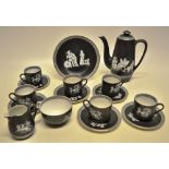 A late Victorian porcelain coffee service, the black ground with athletes from ancient Greece,