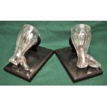 A pair of early Victorian cut glass boot stirrup cups, 5in (13cm), with ebonised wooden stands.