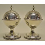 A pair of George III style silver globe peppers, with gadroon borders, pierced covers with