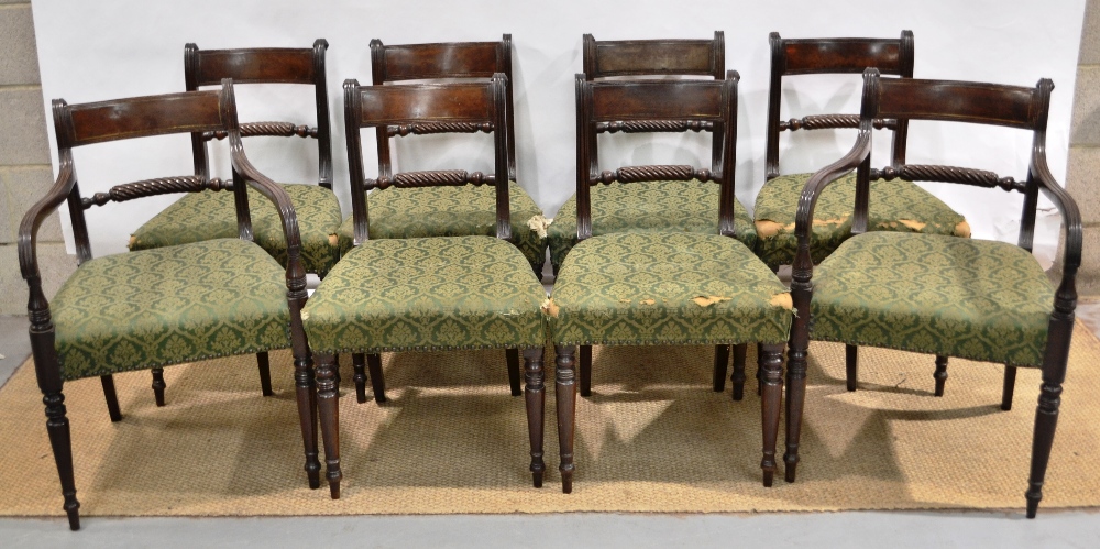 A set of eight Regency mahogany dining chairs, with rope twist rail backs, the stuffed over seats on