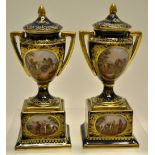 A small pair of nineteenth century Vienna porcelain urns, with covers decorated hand coloured
