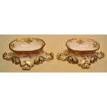 A pair of William IV porcelain oval trenchers salts, with gilt decoration and a puce body to splay
