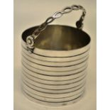 A George II silver cream pail, with faux coopering and a pierced swing handle. Makers mark for
