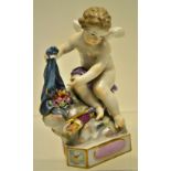 A nineteenth century Meissen porcelain figure of cupid, seated on a mossy bank with a sheaf of