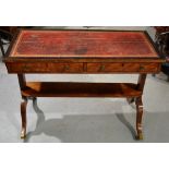 A Sheraton satinwood veneered writing table, the top with replaced red leather and ebony veneered