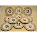 A set of twelve Victorian porcelain plates, hand painted different flowers, a leaf and florette