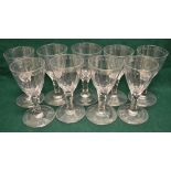 A set of eight early nineteenth century wine glasses, with part panel cut bowls, ovolo cut rims,