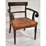 A Regency mahogany elbow chair, with a curved bar back and channelled out scrolling arms to a