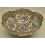 An early twentieth century Cantonese porcelain lotus shape bowl, decorated in famille rose